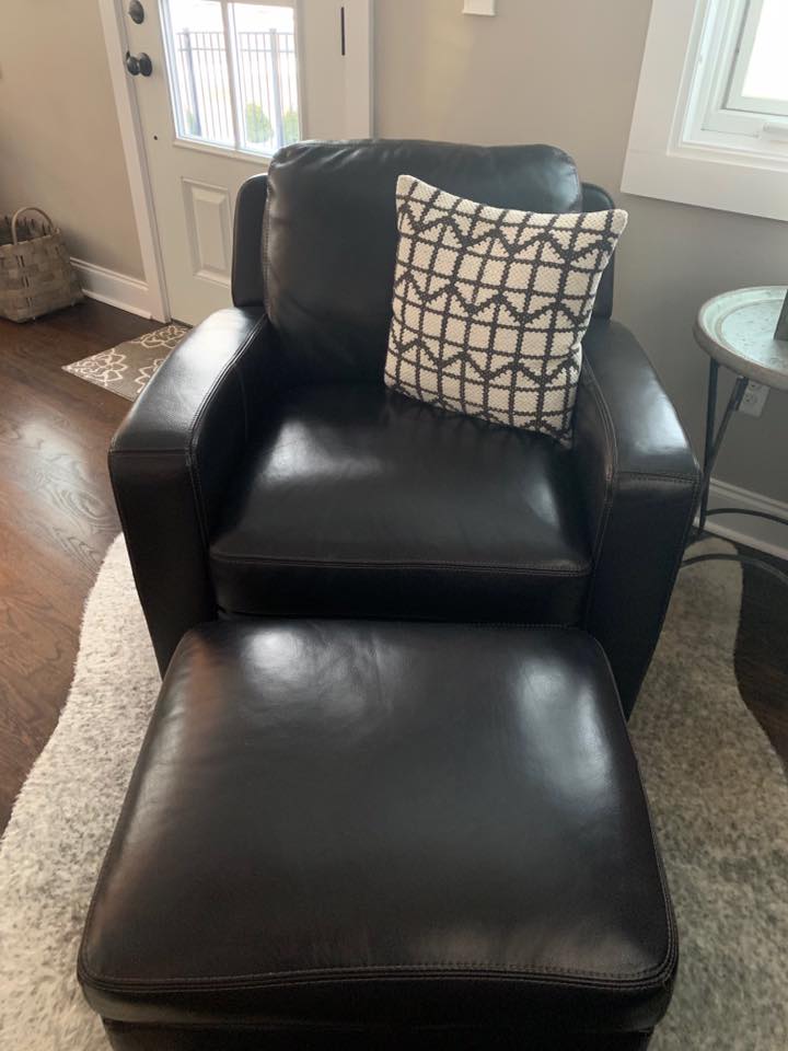 Refurbished leather chair with an ottomon 